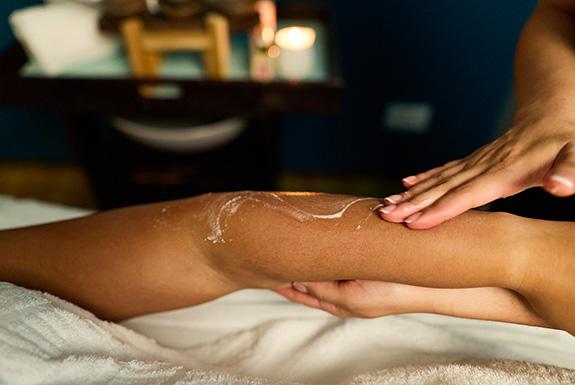 Adult having a traditional shea butter massage